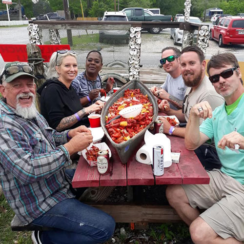 Massive seafood boil spread featuring fresh Louisiana crawfish, crabs, and shrimp
